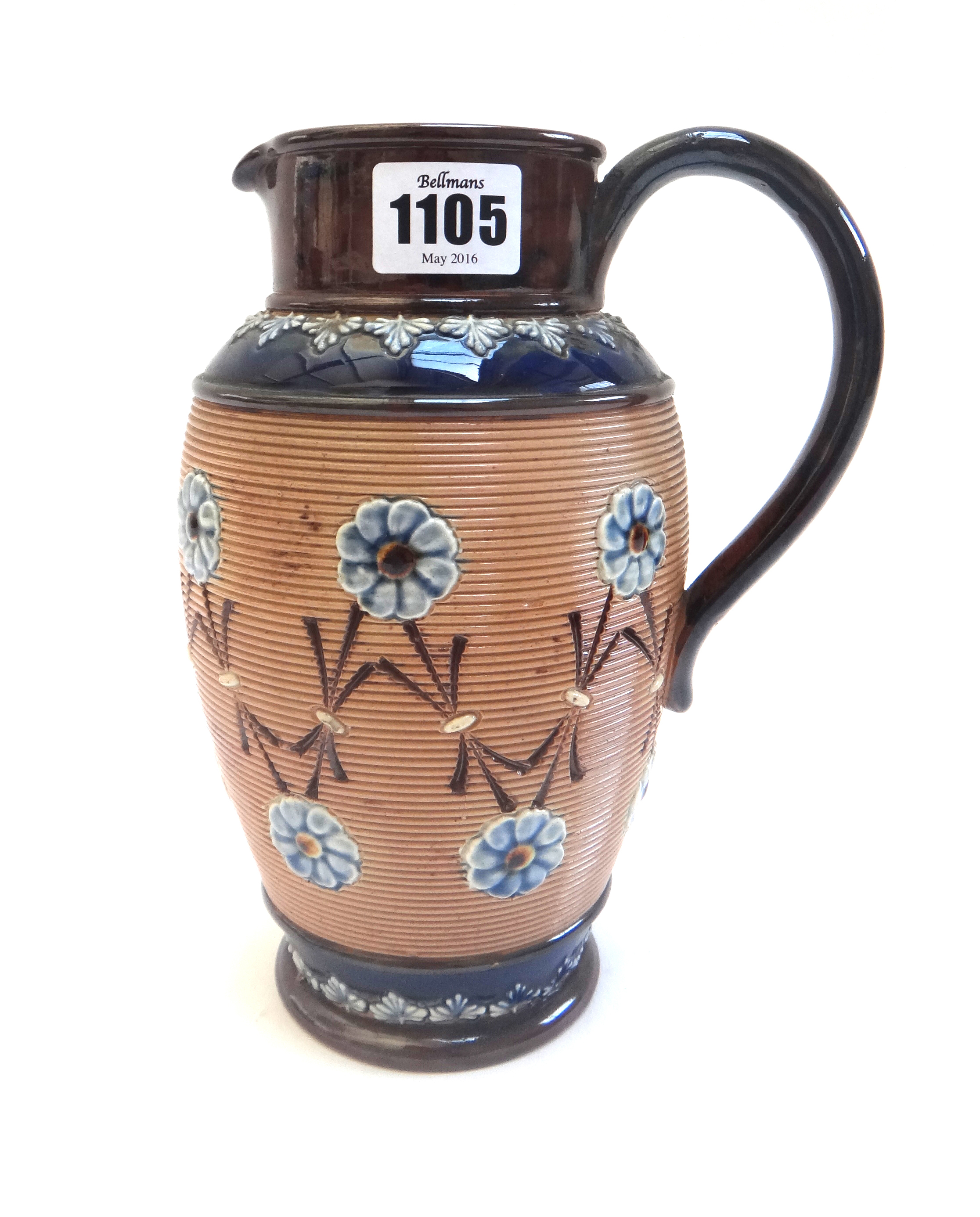 A set of three graduated Royal Doulton stoneware jugs decorated with applied flowers,