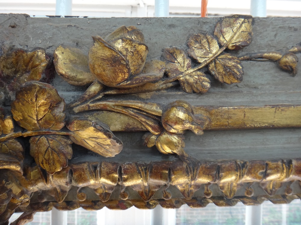 A painted and giltwood overdoor mantel, 19th century, carved and moulded with flowers and bows, 106. - Image 3 of 4