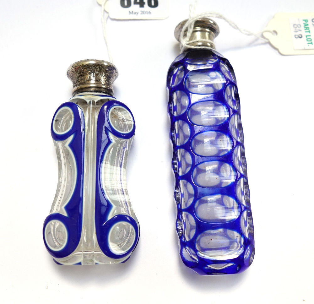 A Victorian blue flashed cut glass scent bottle with white metal screw cap, 11.