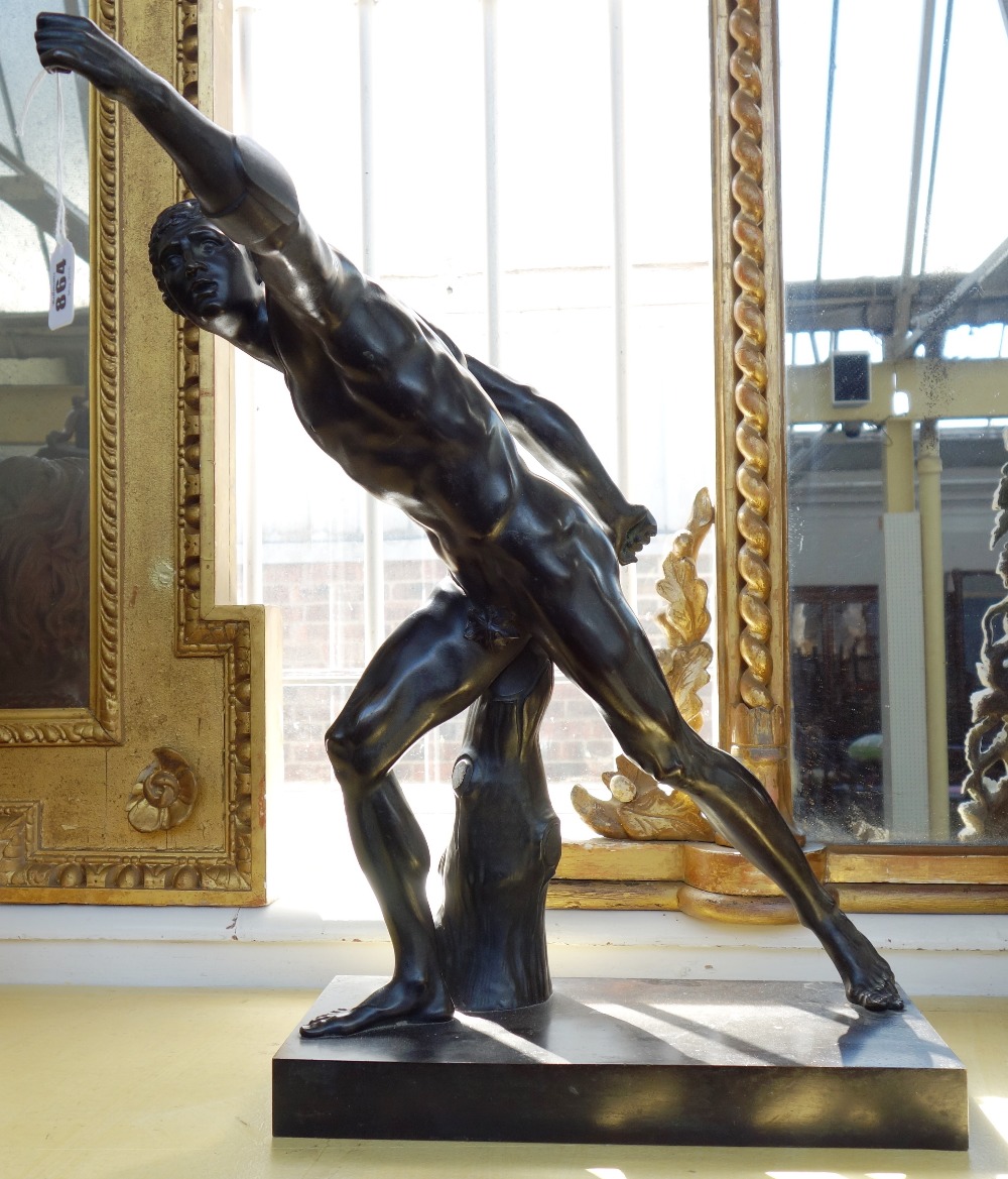 After the antique; a late 19th century bronze figure modelled and cast as a Romanesque male nude,