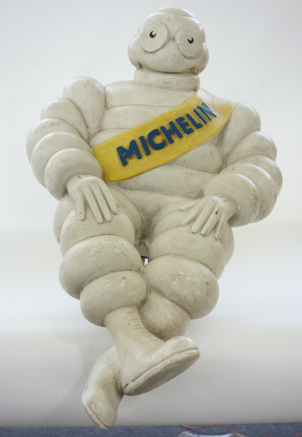 A Michelin 'Bibendum' man with metal mount to rear (57cm) and a Mercedes Benz vintage enamel