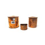 Two copper boxes and a Keswick copper napkin ring, early 20th century, each box of cylindrical form,