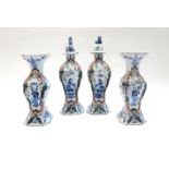 A garniture of Dutch Delft vases and covers, late 19th century, of baluster form,