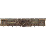 A painted and giltwood overdoor mantel, 19th century, carved and moulded with flowers and bows, 106.