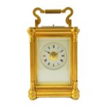 A French gilt brass cased hour repeating carriage clock, early 20th century, with pillar supports,