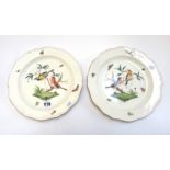 A pair of Wedgwood creamware plates, 19th century, each painted with two birds perched in branches,