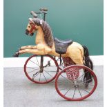 A reproduction horse tricycle (velocipede),