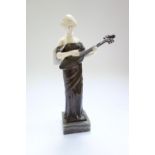 An early 20th century bronze and ivory figure,