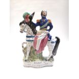 A collection of nine Staffordshire pottery flatback figures and groups,