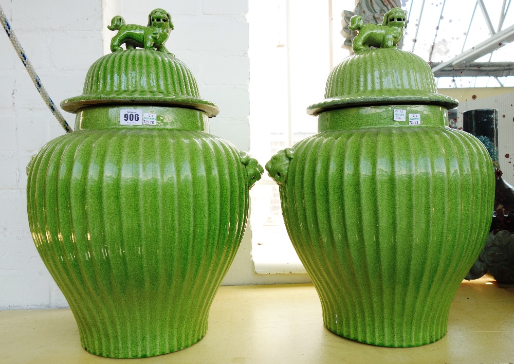 A pair of modern Chinese style pottery vases and covers,