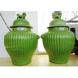 A pair of modern Chinese style pottery vases and covers,