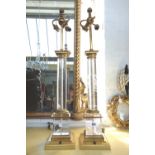 A pair of rock crystal table lamps, with turned columns on brass mounted square bases, 60cm high,