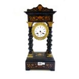 A French ebonised portico mantel clock, 19th century,