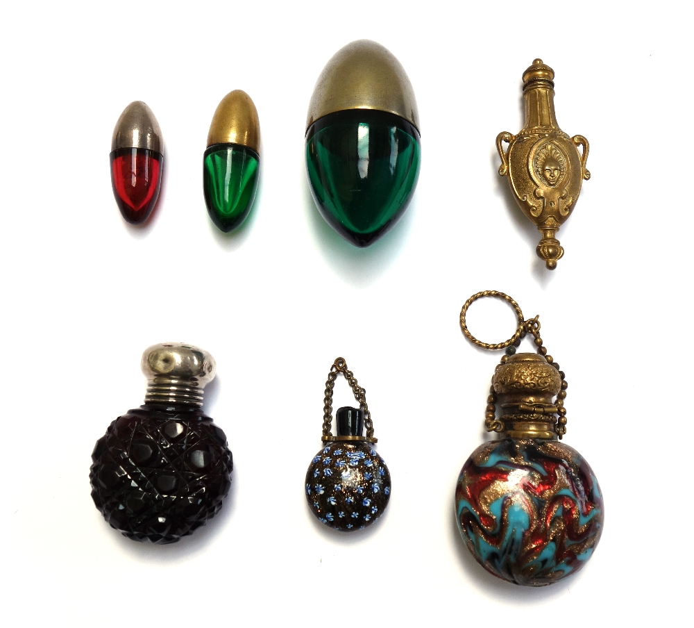 Three coloured glass and metal mounted scent bottles, early 20th century, of egg form,