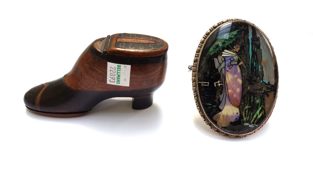 A Victorian mahogany and ebonised novelty snuff box modelled as a heeled shoe,