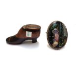 A Victorian mahogany and ebonised novelty snuff box modelled as a heeled shoe,