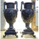 A pair of patinated bronze two handled urns, 20th century, each of Grecian revival style,