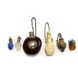 A novelty scent bottle made from a conker or similar nut, with white metal mounts, 5cm,