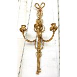 A pair of gilt three branch wall lights, with triple candle branches,