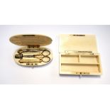 An ivory cased etui, 19th century, oval, monogrammed lid enclosing a gilt metal sewing set (11.