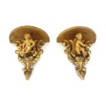 A pair of Louis XV style giltwood wall brackets, late 20th century,