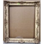 A 20th century painted plaster swept frame, aperture 77cm x 62cm.