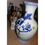 A group of Oriental ceramics and collectables including vases, candlesticks, a cast metal figure,