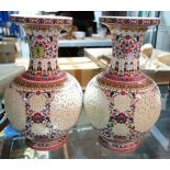 A pair of large 20th century Oriental ceramic vases with pierced decoration.