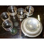 A group of six silver napkin rings and a silver dish.