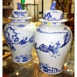 A pair of large blue and white Chinese baluster vases decorated with figures.