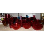 A large quantity of mainly 20th century glass ware including cranberry glass, blue glass, vases,