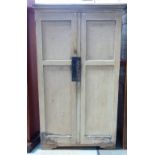 A late 19th/early 20th century cream painted two door cupboard, with fitted interior,