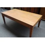 A 20th century rectangular oak dining table, with fluted frieze and tapering square supports,