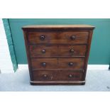 A Victorian mahogany chest, the top dummy drawer revealing four linen trays,