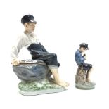 A Royal Copenhagen porcelain figure, 'Shepherd boy on a rock', modelled by Christian Thomsen,