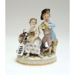 A Meissen porcelain figure group, circa 1900, modelled as a shepherd and shepherdess atop a goat,