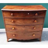 An early 19th century mahogany bowfront chest of four long graduated drawers,