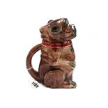 A majolica jug, late 19th century, in the form of a dog seated with open mouth,