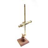 A brass monocular microscope, 19th century, of single tube construction,