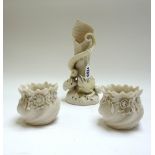 A Belleek porcelain vase, relief moulded with a lizard atop a naturalistic base,
