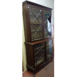 A 19th century mahogany double height glazed display cabinet,