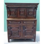 A 17th century and later carved oak court cupboard,