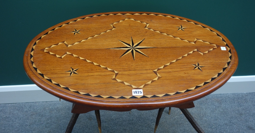 An Anglo-Indian inlaid oval occasional table, on a pair of antler supports, 75cm wide. - Image 2 of 3