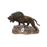 A French bronze lion, late 19th/early 20th century, modelled atop a rock, detailed 'Le Courtier',