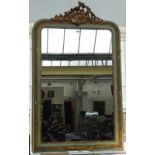 A 19th century later green and gilt decorated over mantel mirror with 'C' scroll crest and moulded