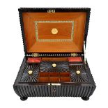 An early 19th century horn veneered sandalwood Anglo-Indian sewing box, of shallow sarcophagus form,