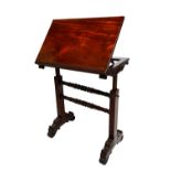 An early 19th century mahogany reading table,