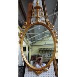 A 19th century gilt framed oval wall mirror of Adams design,