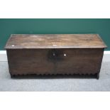 A 17th century oak five plank coffer, with chevron dog tooth frieze and slab end supports,