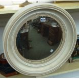 A set of four Regency design, white painted circular convex wall mirrors, each 50cm wide,